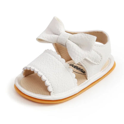 Sandales bébé en cuir blanc avec un noeud papillon spéciale premier pas semelle antidérapante