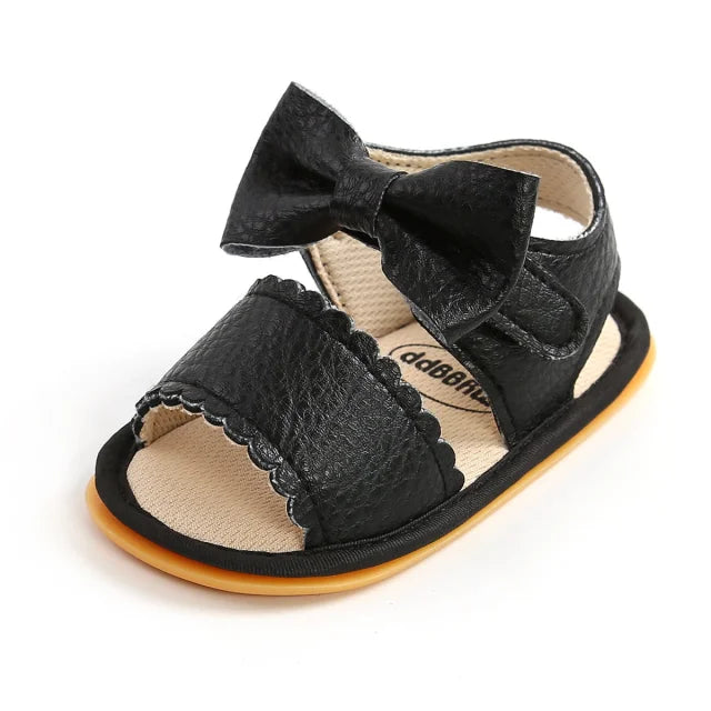 Sandales bébé en cuir noir avec un noeud papillon spéciale premier pas semelle antidérapante